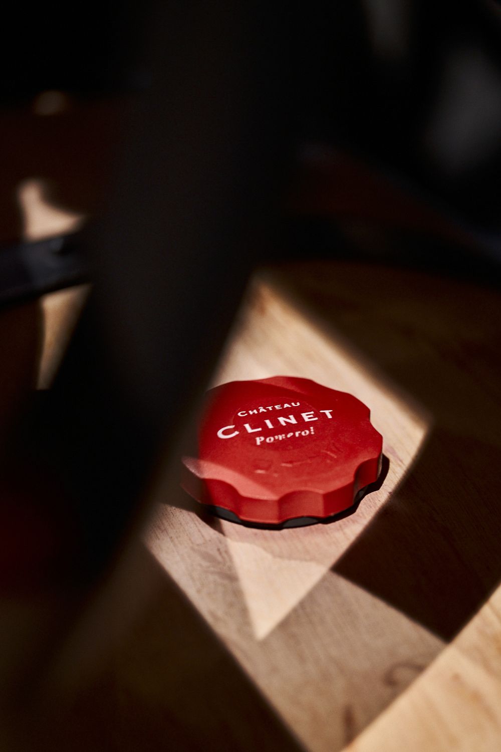 Close up of the red bung on a Clinet wine barrel.